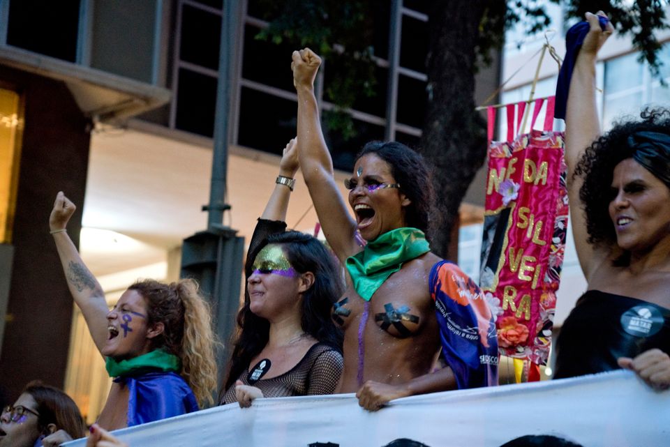 Mulheres marcham em protesto no dia 8 de março, Dia Internacional da Mulher, no Rio de Janeiro,...