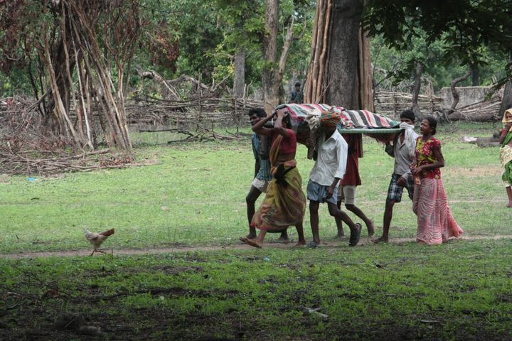 A family carries the body of a villager slain by Indian security forces. 17 villagers in Chhattisgarh were killed by Indian security forces in June 2012.