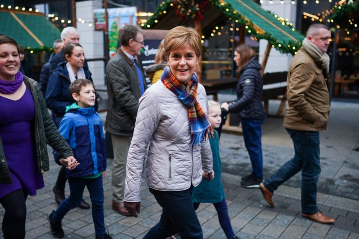 Scottish First Minister Nicola Sturgeon walks through Aberdeen Christmas Market as she joins Kirsty Blackman,