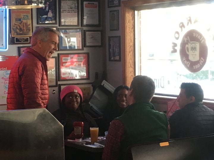 Former Republican congressman and now presidential candidate Joe Walsh (left) greets customers at the Red Arrow Diner in Manchester, New Hampshire.