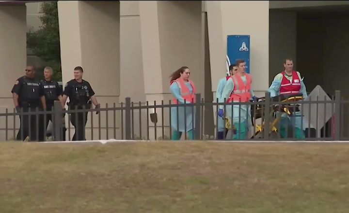 Emergency responders are seen near the Naval Air Base Station in Pensacola where a shooting Friday left three people dead and two deputies wounded.