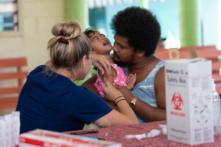 Hawaii aid workers nurses help out with MMR vaccinations on December 6, 2019 in Apia, Samoa.