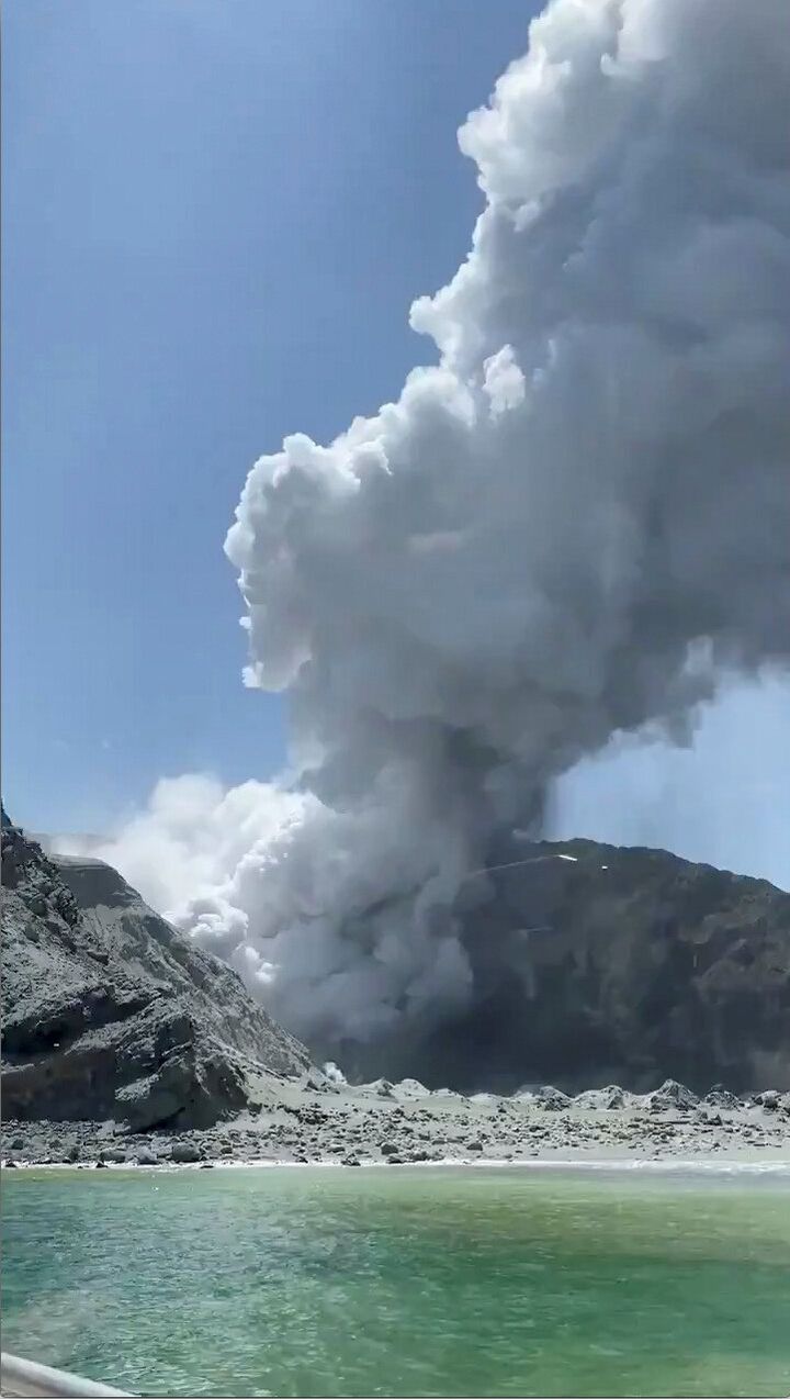 Thick smoke from the volcanic eruption of Whakaari, also known as White Island, is seen from a distance of a vessel in New Zealand, December 9, 2019, in this image obtained via social media. 
