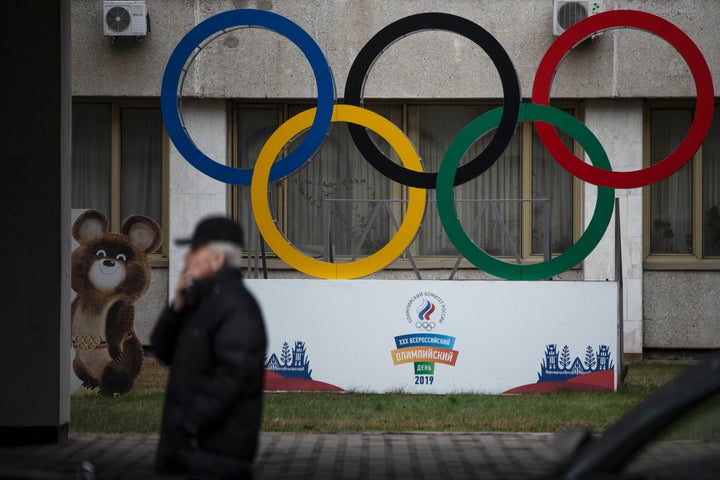 Olympic Rings and a model of Misha the Bear Cub, the mascot of the Moscow 1980 Olympic Games, left, are seen in the yard of Russian Olympic Committee building in Moscow, Russia