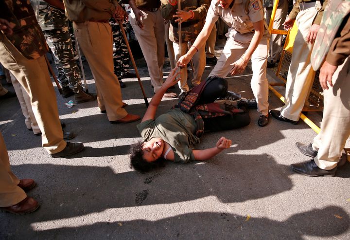 A student of Jawaharlal Nehru University (JNU) reacts as police try to detain her during a protest against a proposed fee hike, in New Delhi, India, November 18, 2019. REUTERS/Danish Siddiqui TPX IMAGES OF THE DAY