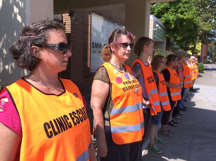 Escort volunteers line up outside the EMW Women's Surgical Center in Louisville, Kentucky, in 2017. The clinic is the state's only licensed abortion clinic