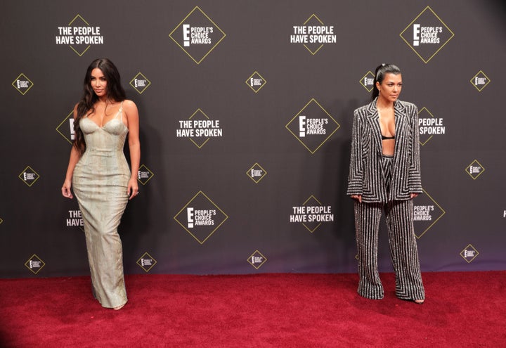 Kim and Kourtney Kardashian posted at the Peoples Choice Awards on Nov. 10. 