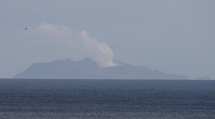 A plume of steam is seen above White Island early morning off the coast of Whakatane, New Zealand, Tuesday, Dec. 10, 2019. 