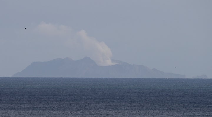 A plume of steam is seen above White Island early morning off the coast of Whakatane, New Zealand, Tuesday, Dec. 10, 2019. 