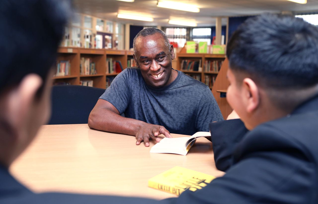 Pupils at Yardleys School in Birmingham meet author Alex Wheatle at a BookTrust event to highlight books by authors and illustrators of colour or those that feature BAME main characters.