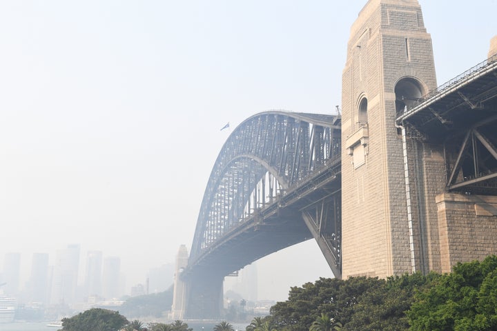 SYDNEY, AUSTRALIA - DECEMBER 10: Smoke haze is seen over the Sydney Harbour Bridge on December 10, 2019 in Sydney, Australia. Smoke haze hangs over the city as the New South Wales fire danger risk is raised from 'very high' to 'severe'. (Photo by James D. Morgan/Getty Images)