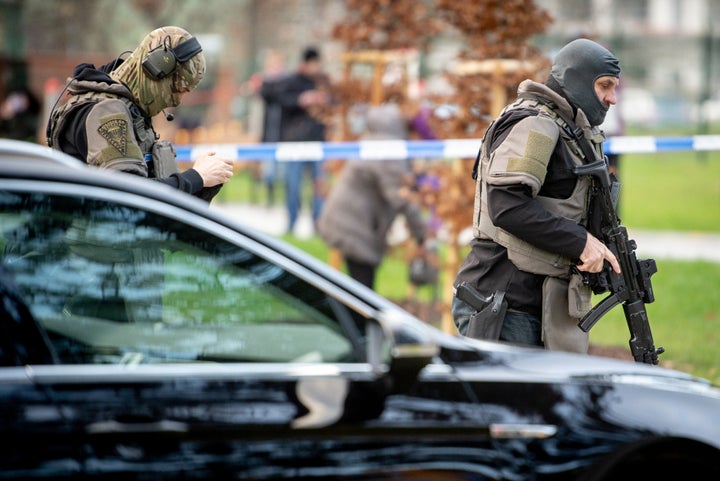 Police officers are seen near the site of the shooting 