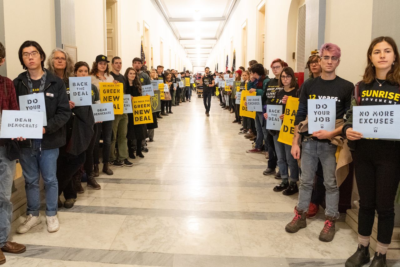 Protesters during the Sunrise Movement protest in November 2018 outside the office of Rep. Nancy Pelosi (D-Calif.) in Washington, D.C., demanding that Democrats support the Green New Deal.