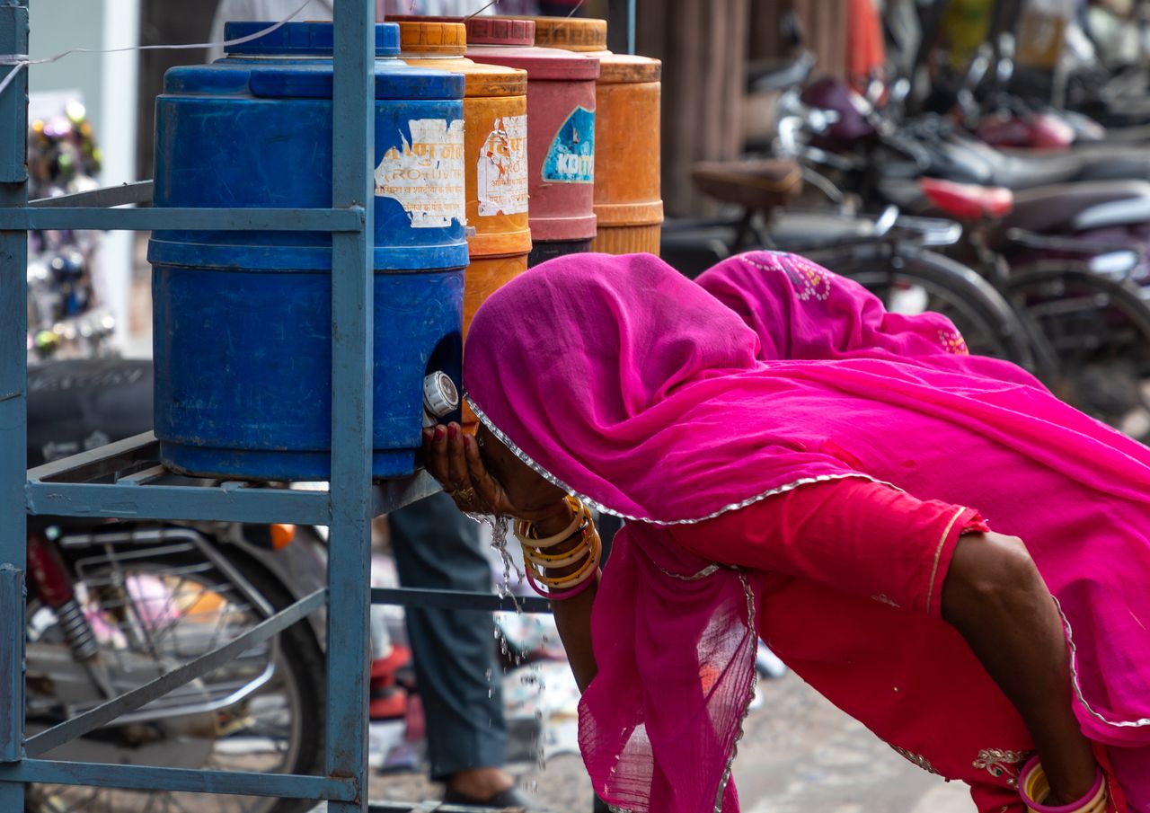 Women drinking water in the street during the heat wave in Bikaner, Rajasthan, India on July 25, 2019. Temperatures in the state reached more than 123 degrees Fahrenheit in July.