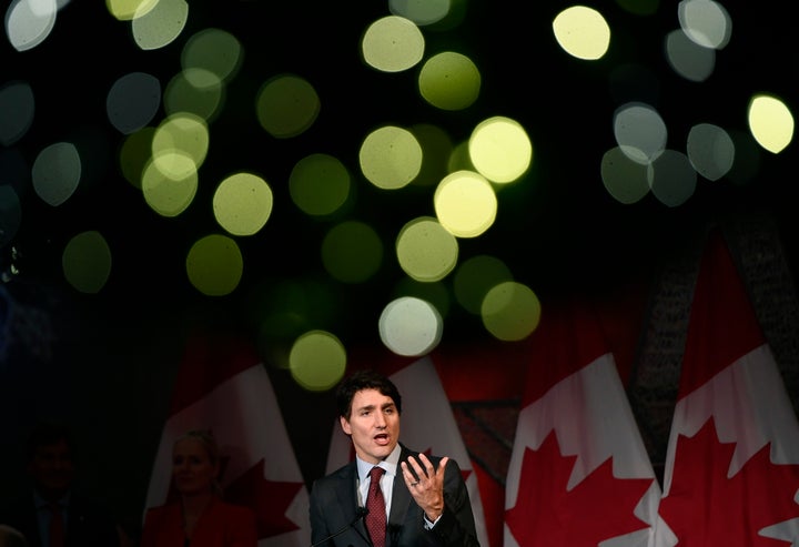 Christmas lights on a wreath glow above Prime Minister Justin Trudeau as he speaks to supporters at the Laurier Club holiday reception, an annual donor event held by the Liberal Party of Canada, in Ottawa on Dec. 9, 2019.