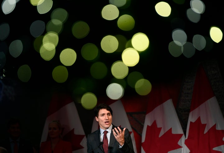 Christmas lights on a wreath glow above Prime Minister Justin Trudeau as he speaks to supporters at the Laurier Club holiday reception, an annual donor event held by the Liberal Party of Canada, in Ottawa on Dec. 9, 2019.