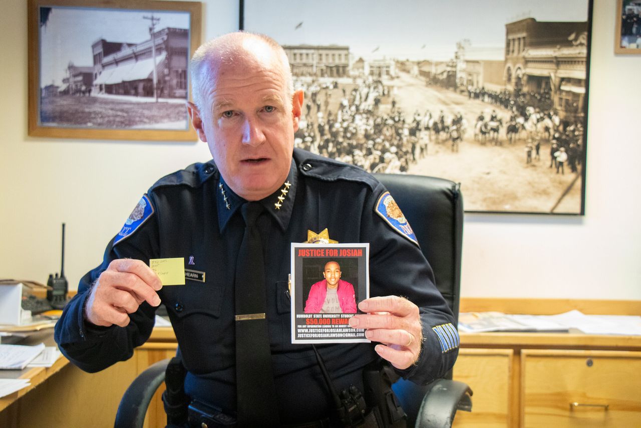 Arcata, California, Police Chief Brian Ahearn holds up a photo of slain student David Josiah Lawson and a note showing how many days Lawson's killing has gone unsolved.