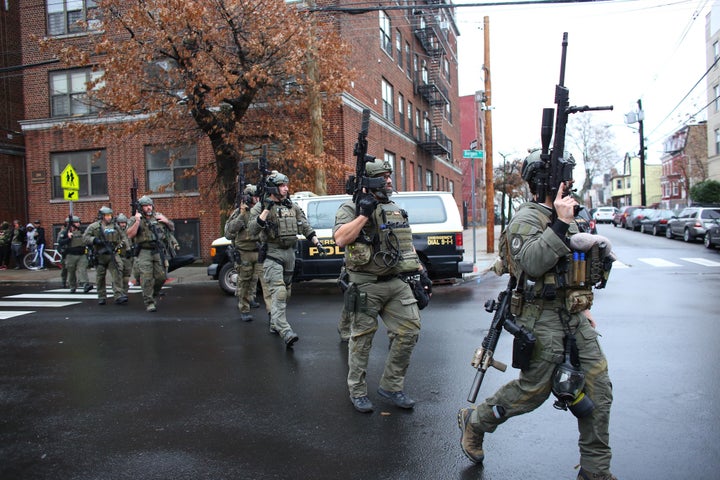 Police officers arrive to the scene where an active shooting was taking place in Jersey City, New Jersey on Dec. 10.