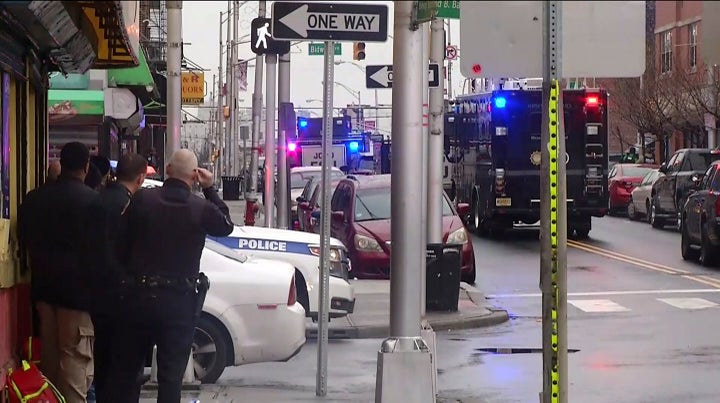 In this image taken from video, police officers respond at the scene following reports of gunfire on Tuesday.