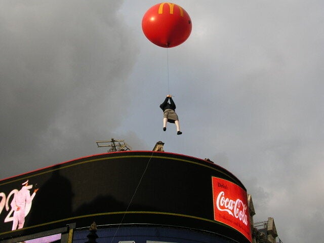 Banksy's floating girl was later struck by a bus.