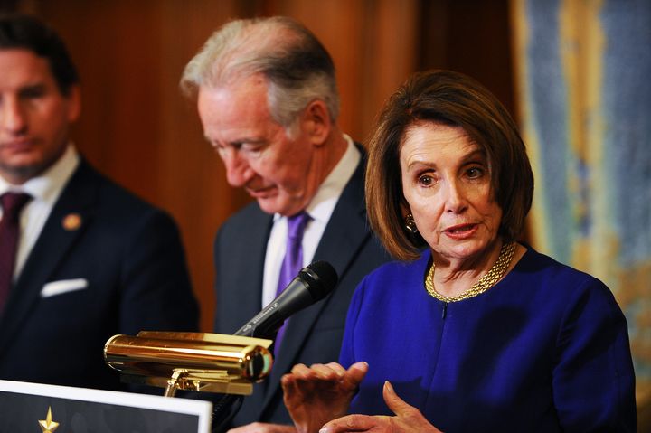 House Speaker Nancy Pelosi (D-Calif.), shown here with Ways and Means Chair Richard Neal (D-Mass.), has denounced the Trump tax cuts as a "GOP tax scam for the rich."