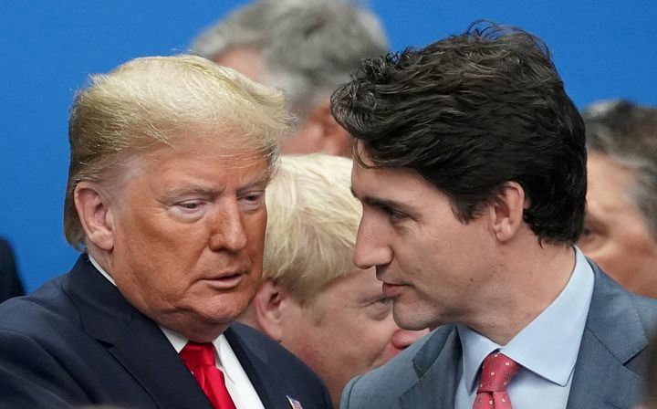 U.S. President Donald Trump talks with Prime Minister Justin Trudeau at the NATO summit in Watford, U.K. on Dec. 4, 2019. Trudeau has Trump beat when it comes to job growth on their watch, an analysis from Scotiabank finds.