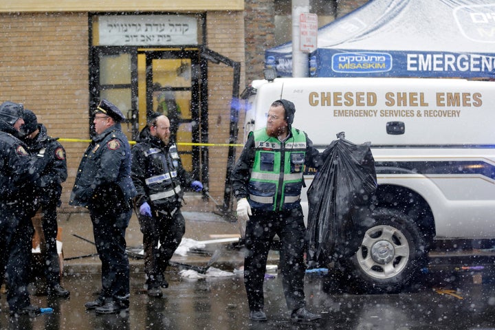 Emergency responders work Wednesday near a kosher supermarket and a synagogue near the site of a shooting in Jersey City, New Jersey.