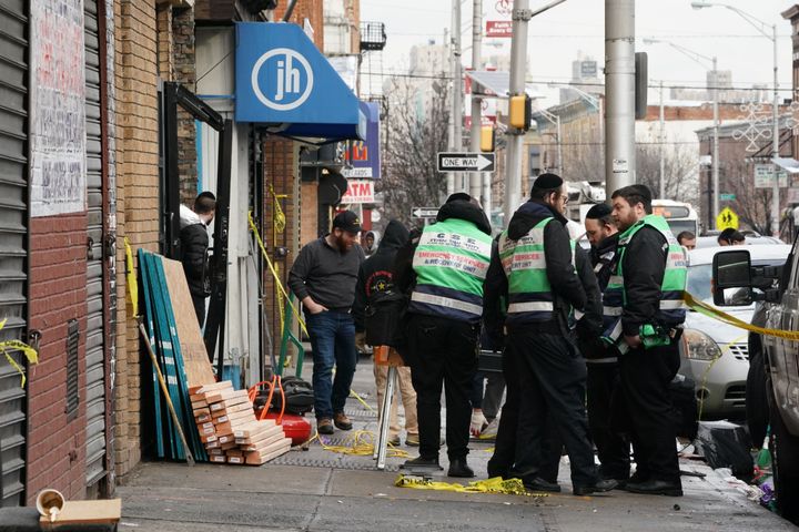 A crew works at the scene of Tuesday's shooting at a Jewish deli in Jersey City, New Jersey.