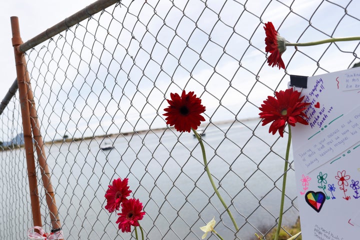 Flowers are seen at a memorial at the harbour in Whakatane, following the White Island volcano eruption in New Zealand, December 11, 2019. REUTERS/Jorge Silva