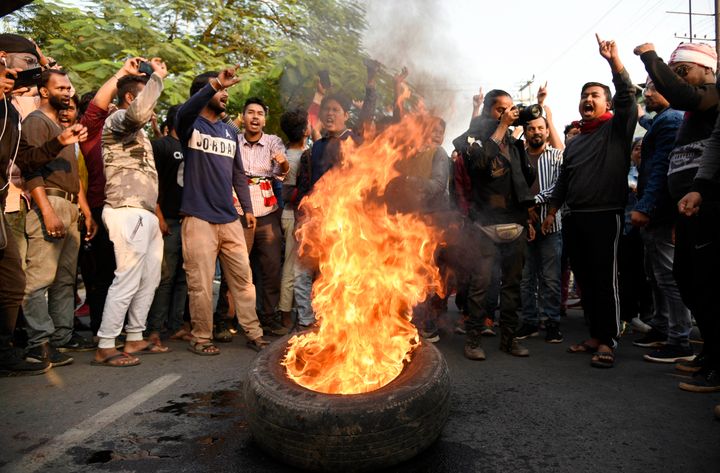 Demonstrators burn tyres during a strike called by All Assam Students Union (AASU) and the North East Students Organisation (NESO) in protest against the Citizenship Amendment Bill, in Guwahati, Assam, Dec. 10, 2019. 