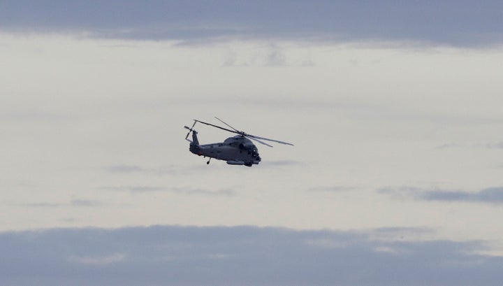 A New Zealand Navy helicopter takes off from Whakatane Airport as the mission to return victims of the White Island eruption