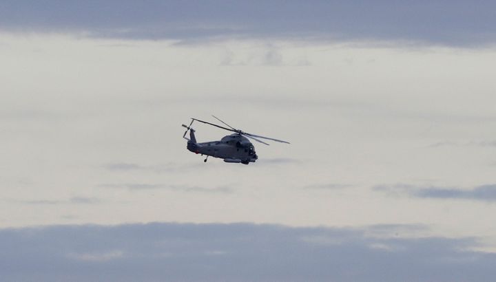 A New Zealand Navy helicopter takes off from Whakatane Airport as the mission to return victims of the White Island eruption 