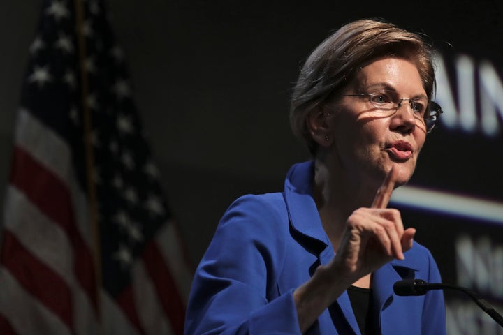 Democratic presidential candidate Sen. Elizabeth Warren, D-Mass., gestures during her address at the New Hampshire Institute