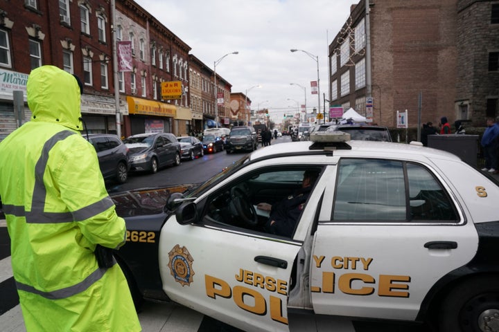 Jersey City police gather at the scene of Tuesday's shooting in Jersey City, New Jersey.