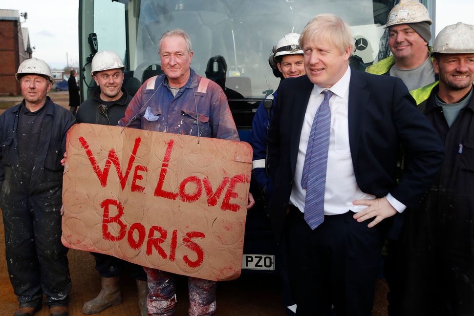 Boris Johnson poses with workers during a visit to Wilton Engineering Services in the 'red wall' area of Middlesbrough, on November 20