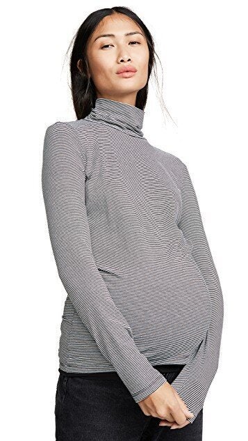 <a href="https://fave.co/2LNKHJl">Black and white jersey turtleneck, Hatch, </a>£74.49.