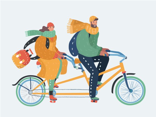 Young couple riding a tandem bicycle. Man and woman in winter or autumn clothes with scarfs are cycling on twin bike. Vector cartoon illustration in modern concept