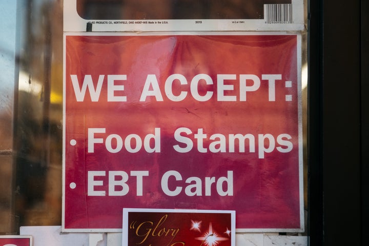 A sign alerting customers about SNAP food stamps benefits is displayed at a Brooklyn grocery store in New York City.