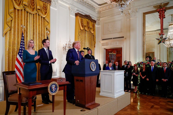 President Donald Trump is applauded by White House senior advisors Ivanka Trump and Jared Kushner prior to signing an executive order on anti-Semitism on December 11, 2019.