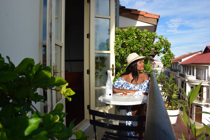 I enjoy balcony views from Panama City's American Trade Hotel.