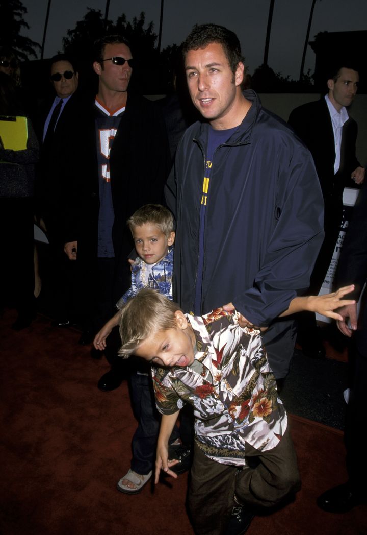 Adam Sandler, Cole Sprouse and Dylan Sprouse at the Avco Cinema in Westwood, California, in 1999.