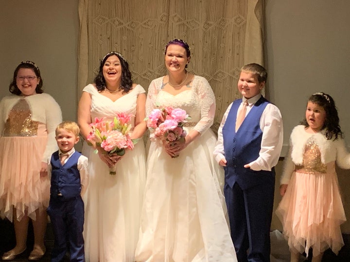 The brides and their four kids. Look at those smiles!&nbsp;