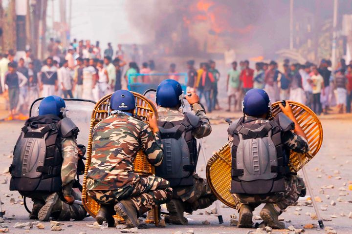 Protesters clash with police on a road during a demonstration against Citizenship Act in Howrah.