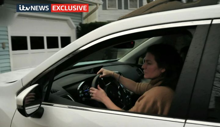 Video grab taken from ITV News of Anne Sacoolas at the wheel of her car reversing out of a driveway before pulling away.