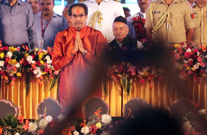 Shiv Sena party leader Uddhav Thackeray greets supporters after taking oath as chief minister of Maharashtra state during a swearing-in-ceremony in Mumbai, Thursday, Nov. 28, 2019. 