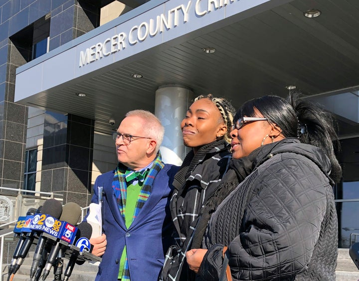 Jazmine Headley, center, joins attorney Brian Neary and her mother, Jacqueline Jenkins, outside a courthouse in Trenton, N.J., on Dec. 12, 2018. 