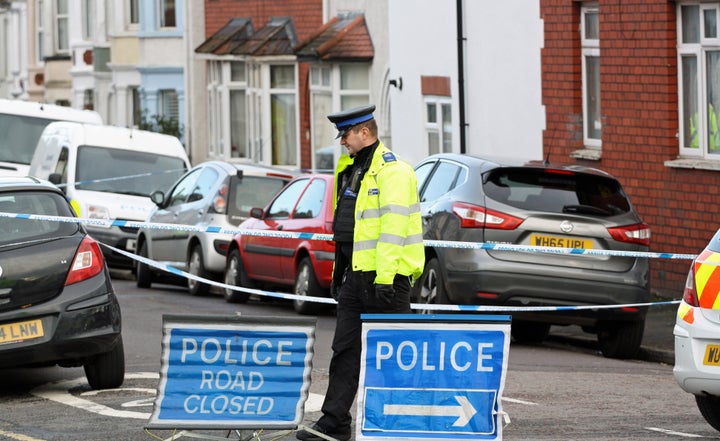 <strong>A PCSO stands on duty in Mansfield Street, Bedminister, Bristol, following the launch of a murder inquiry after the death of a 17-year-old-boy who was found fatally injured in the street.</strong>