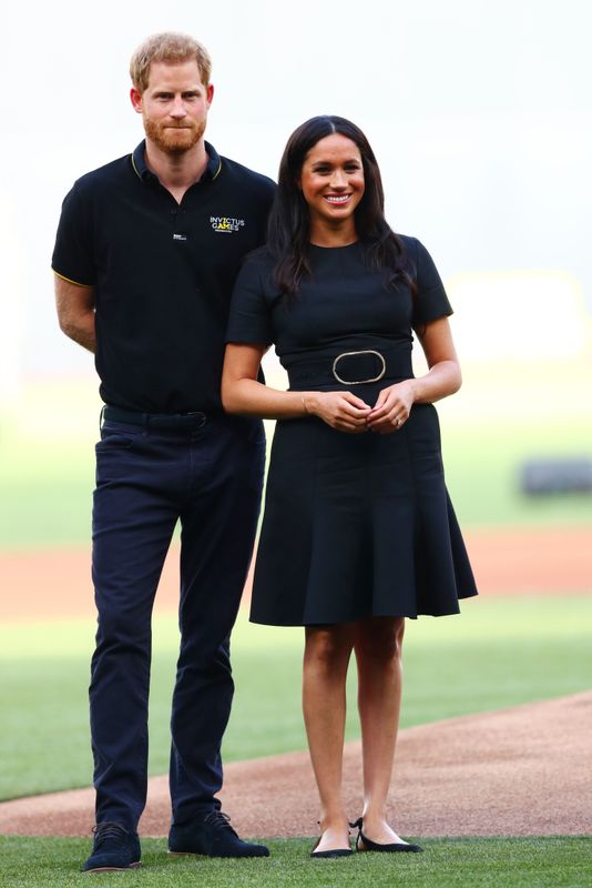 Harry and Meghan look on during the pre-game ceremonies before the MLB London Series game between the Boston Red Sox and the New York Yankees.