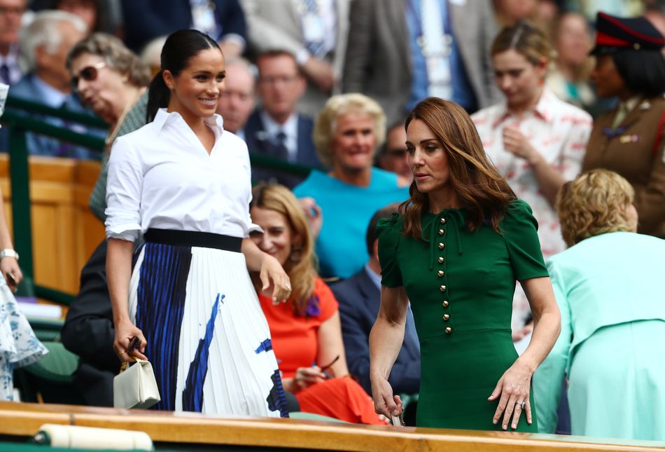 The Duchess of Sussex and the Duchess of Cambridge in the Royal Box ahead of the Wimbledon women's final between Serena Williams of the U.S. and Romania's Simona Halep.