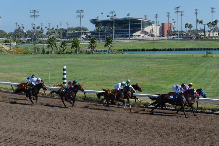 Thoroughbred horses make their way around the track at Los Alamitos Race Course in Cypress, California, in 2016. Two horses died there on Saturday during the day's first race.